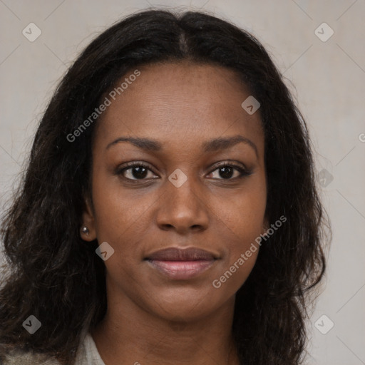 Joyful black young-adult female with long  brown hair and brown eyes