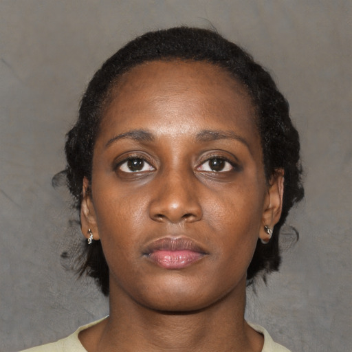 Neutral black young-adult female with medium  black hair and brown eyes