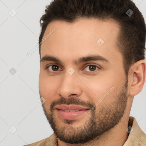 Joyful white young-adult male with short  brown hair and brown eyes