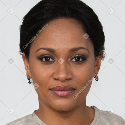 Joyful black young-adult female with short  black hair and brown eyes