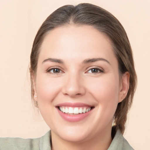 Joyful white young-adult female with medium  brown hair and brown eyes