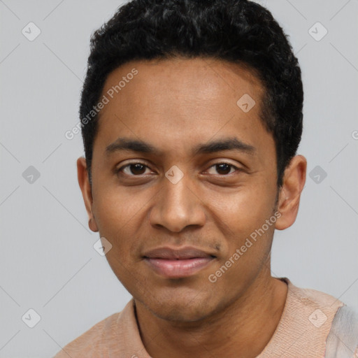 Joyful black young-adult male with short  black hair and brown eyes