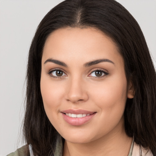 Joyful white young-adult female with long  brown hair and brown eyes