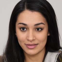 Joyful asian young-adult female with long  brown hair and brown eyes