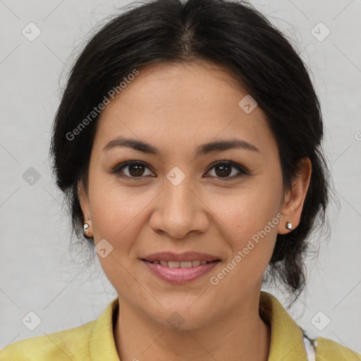 Joyful latino adult female with medium  brown hair and brown eyes