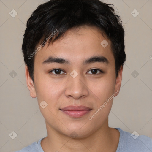 Joyful asian young-adult male with short  brown hair and brown eyes