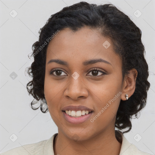 Joyful black young-adult female with long  brown hair and brown eyes