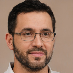 Joyful white adult male with short  brown hair and brown eyes