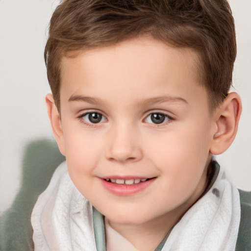 Joyful white child male with short  brown hair and brown eyes