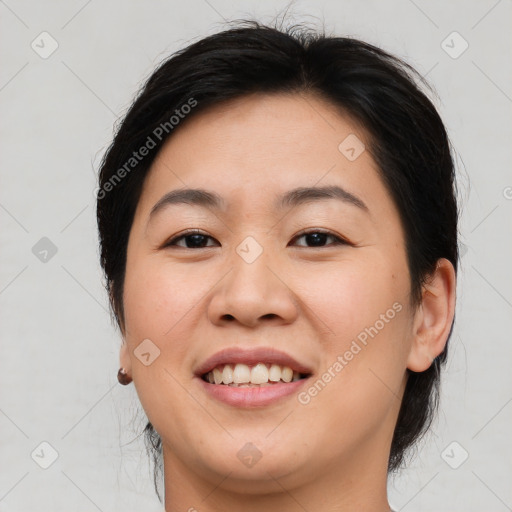 Joyful asian young-adult female with medium  brown hair and brown eyes