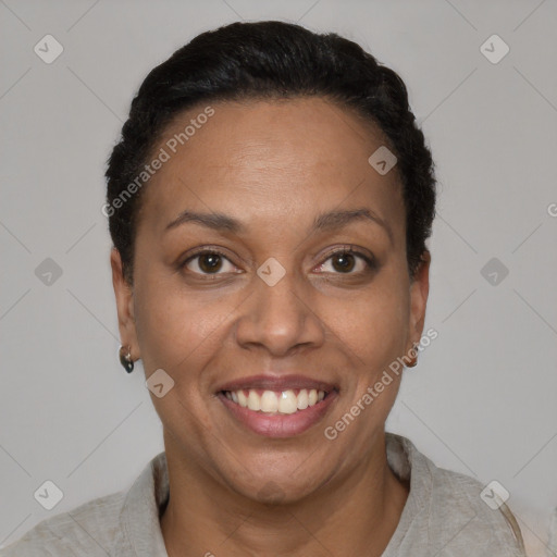 Joyful black adult female with short  black hair and brown eyes