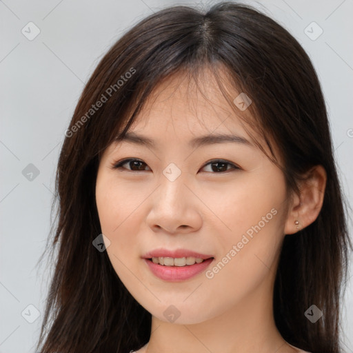 Joyful asian young-adult female with long  brown hair and brown eyes