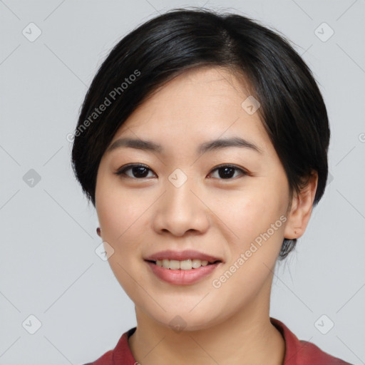 Joyful asian young-adult female with medium  black hair and brown eyes