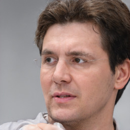 Neutral white adult male with short  brown hair and brown eyes