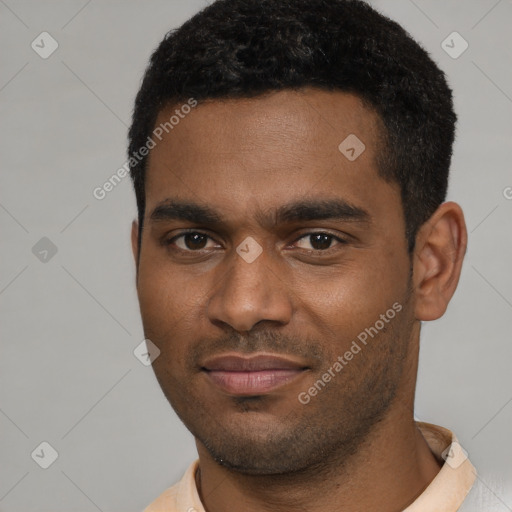 Joyful black young-adult male with short  brown hair and brown eyes