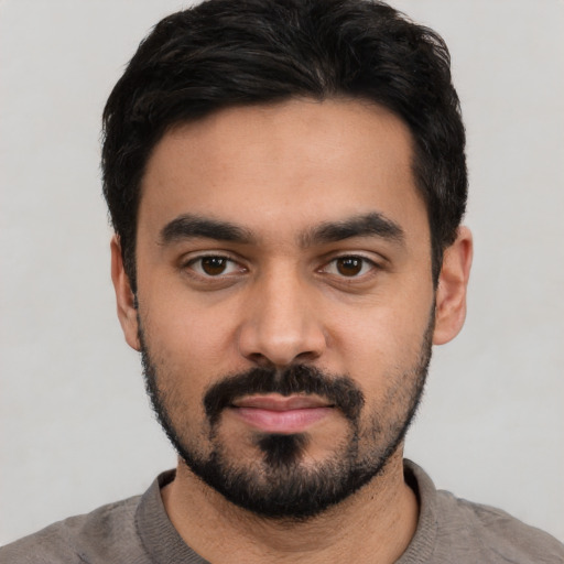Neutral latino young-adult male with short  black hair and brown eyes
