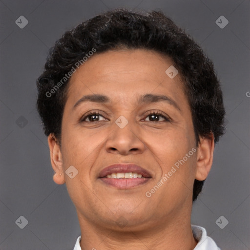 Joyful latino adult female with short  brown hair and brown eyes