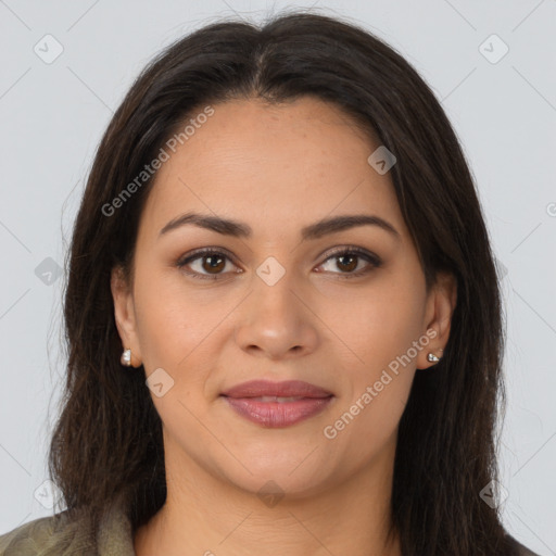 Joyful latino young-adult female with long  brown hair and brown eyes