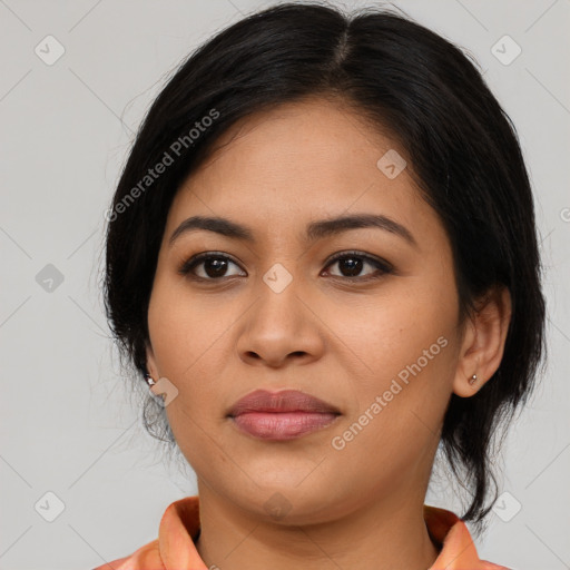 Joyful latino young-adult female with medium  brown hair and brown eyes