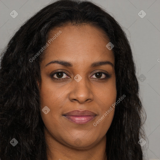 Joyful black young-adult female with long  brown hair and brown eyes