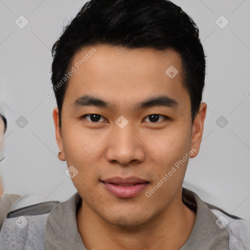 Joyful asian young-adult male with short  black hair and brown eyes