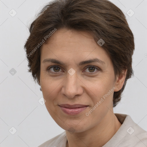 Joyful white adult female with short  brown hair and brown eyes