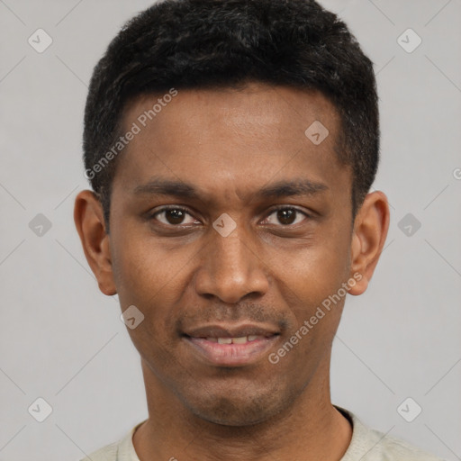 Joyful black young-adult male with short  black hair and brown eyes
