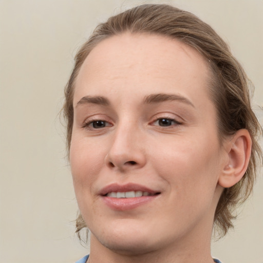 Joyful white young-adult female with medium  brown hair and blue eyes