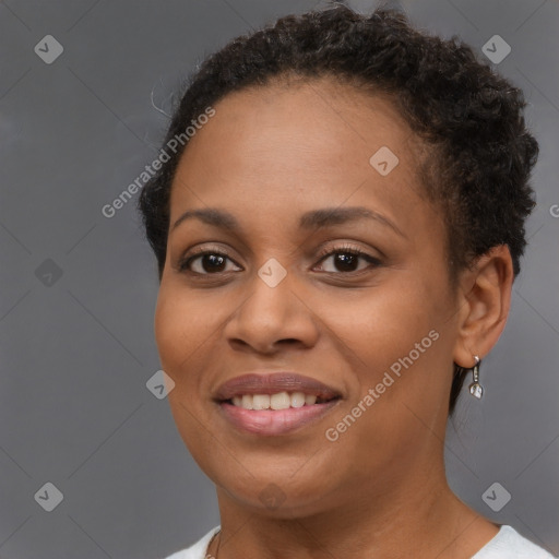 Joyful black young-adult female with short  brown hair and brown eyes