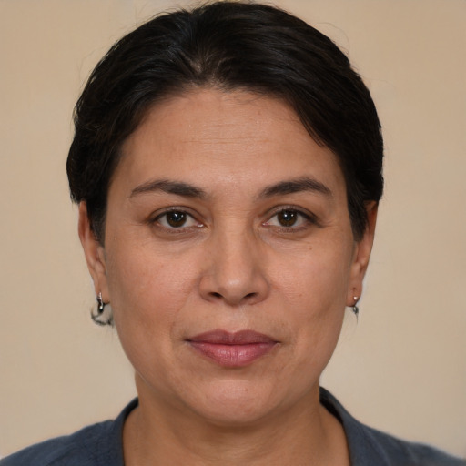 Joyful white adult female with short  brown hair and brown eyes