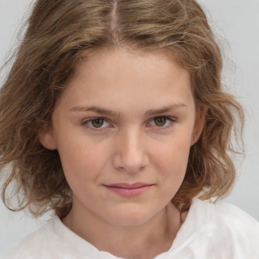 Joyful white child female with medium  brown hair and brown eyes