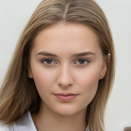 Neutral white young-adult female with long  brown hair and brown eyes