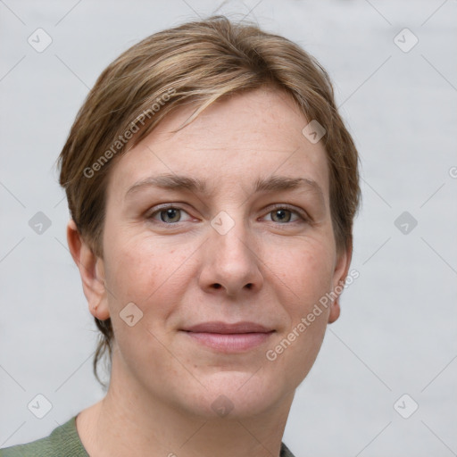 Joyful white young-adult female with short  brown hair and grey eyes