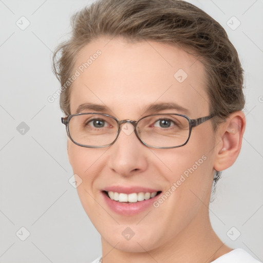 Joyful white adult female with short  brown hair and grey eyes