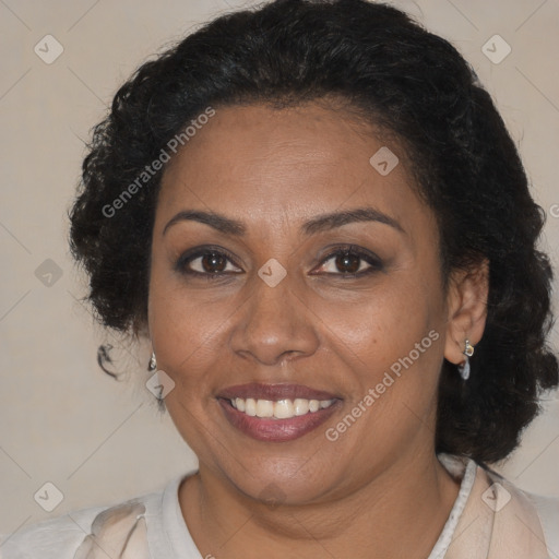 Joyful black adult female with medium  brown hair and brown eyes