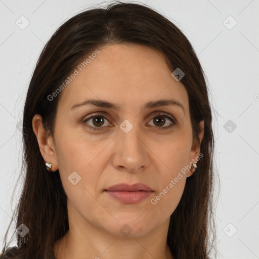 Joyful white adult female with long  brown hair and brown eyes