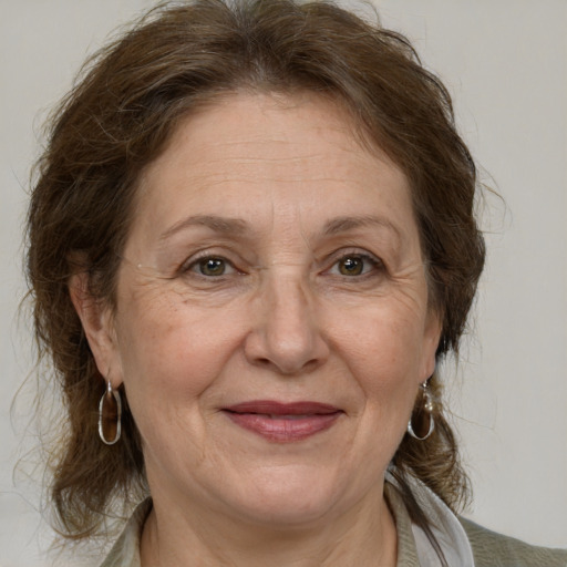 Joyful white middle-aged female with medium  brown hair and brown eyes