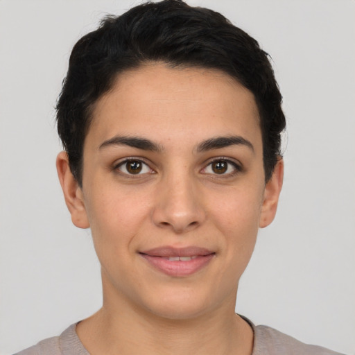 Joyful latino young-adult female with short  brown hair and brown eyes