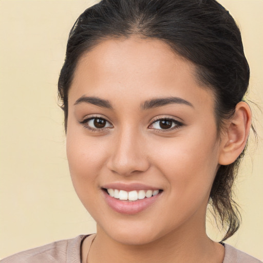 Joyful white young-adult female with medium  brown hair and brown eyes