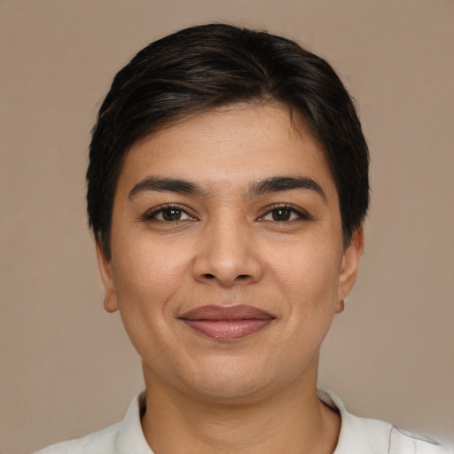 Joyful latino young-adult female with short  brown hair and brown eyes