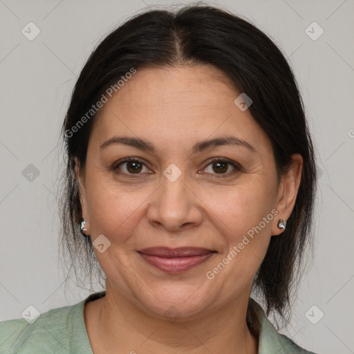 Joyful white adult female with medium  brown hair and brown eyes