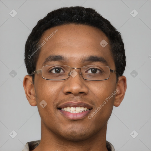 Joyful black young-adult male with short  black hair and brown eyes