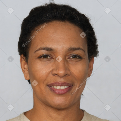 Joyful black adult female with short  brown hair and brown eyes