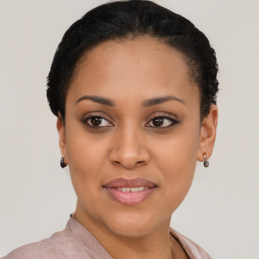 Joyful latino young-adult female with short  black hair and brown eyes