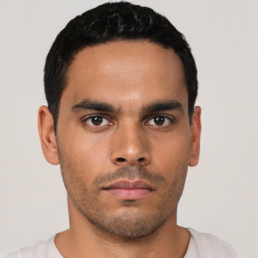 Neutral latino young-adult male with short  black hair and brown eyes