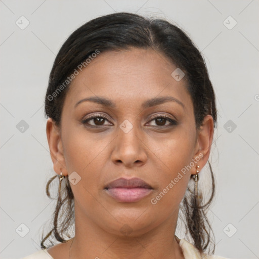 Joyful latino young-adult female with medium  brown hair and brown eyes