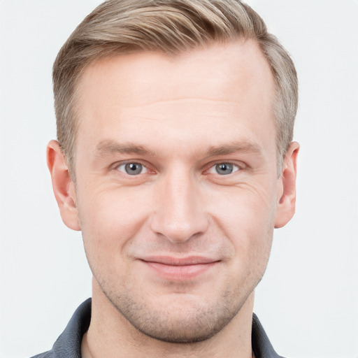 Joyful white adult male with short  brown hair and grey eyes