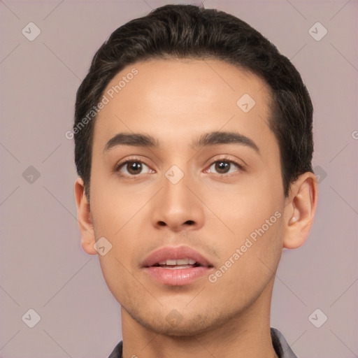 Joyful white young-adult male with short  black hair and brown eyes