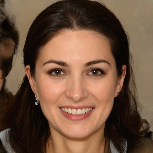 Joyful white young-adult female with medium  brown hair and brown eyes