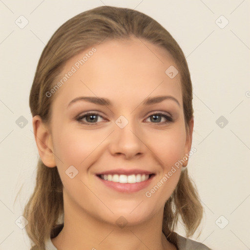 Joyful white young-adult female with long  brown hair and grey eyes